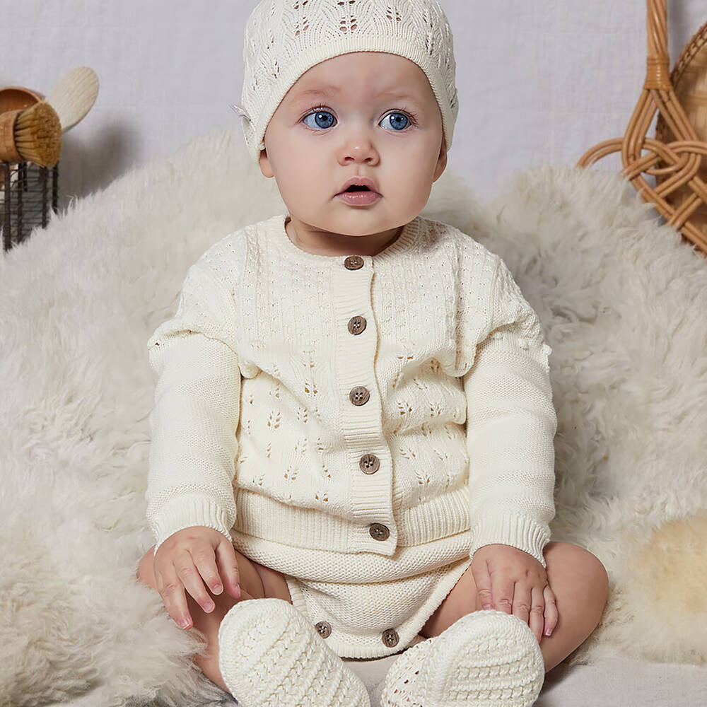 The Little Tailor Ivory Knitted Baby Cardigan | Childrensalon