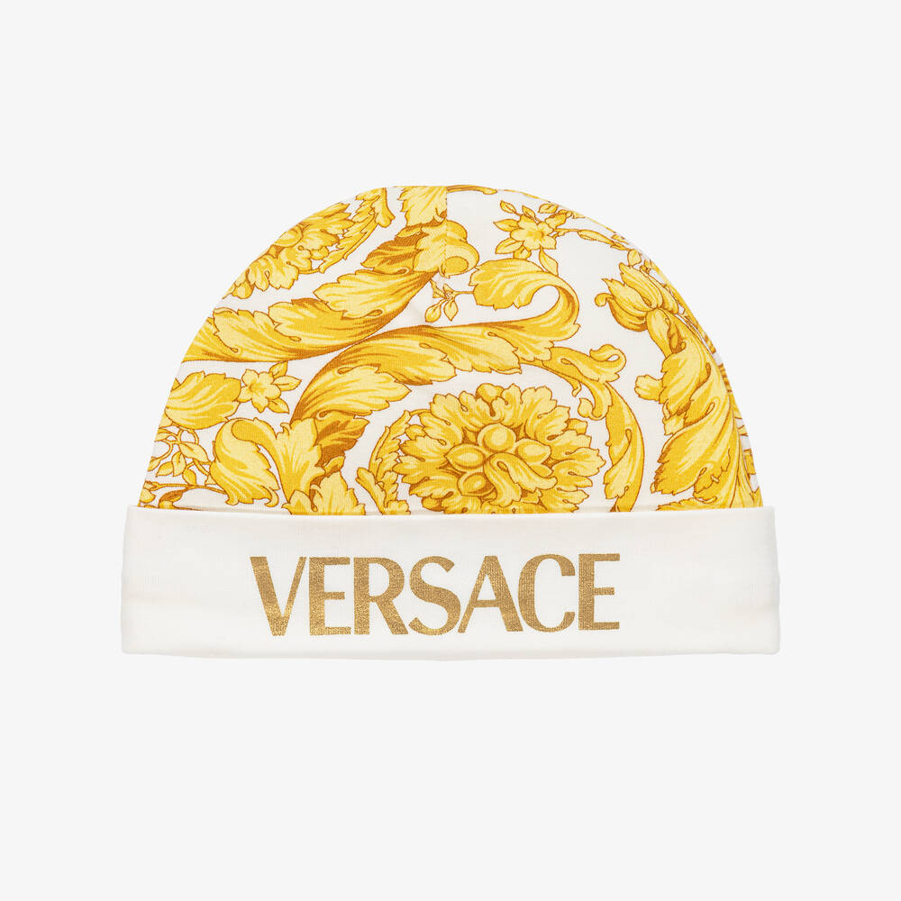 Versace - قبعة قطن جيرسي لون أبيض وذهبي بطبعة باروك | Childrensalon