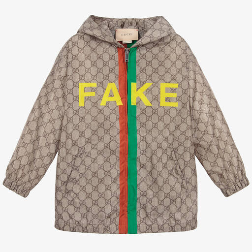 Gucci-Бежевая нейлоновая куртка с принтом Fake/Not GG | Childrensalon
