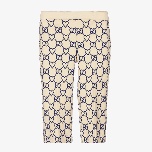 Gucci-Кремовые брюки с сердечками и принтом GG | Childrensalon